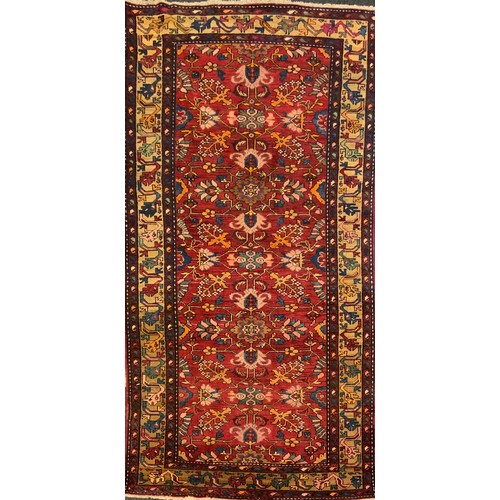 307 - A North west Persian Malayer rug / carpet, hand-knotted with a central field of stylised flowers, an... 