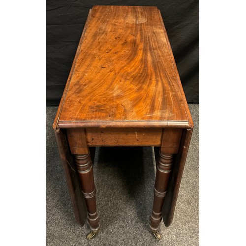 311 - A George III mahogany drop-leaf dining table, rounded rectangular top, turned legs, brass casters, 7... 