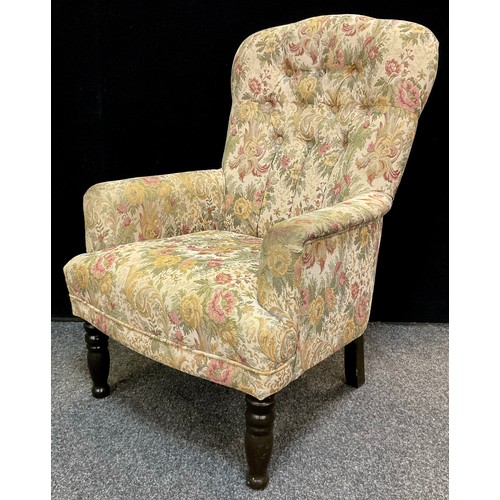 316 - A 20th century button-back fireside armchair, 93cm high x 64cm wide x 68cm deep.