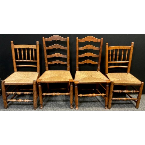 322 - A pair of 19th century Elm rush-seated chairs, ladder-backs, turned stretchers and supports, 101cm h... 