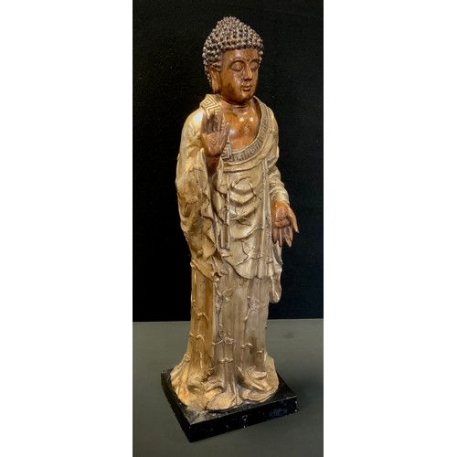 330 - A large Sino Tibetan figure of Buddha standing in contemplation, 76cm high,