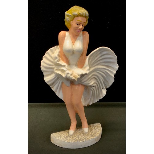 377 - A painted cast iron doorstop, as Marilyn Monroe, 34cm high.