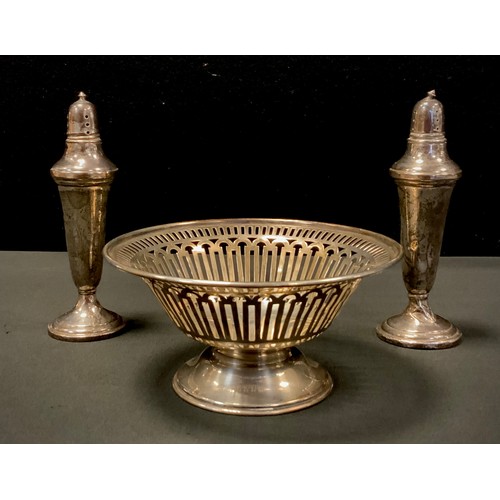 397 - A silver pedestal bonbon dish, Walker & Hall, 4.40zt;  pair of weighted sterling silver pepper and s... 