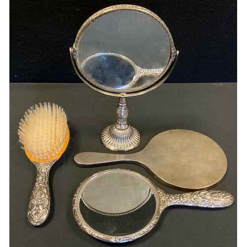 401 - A silver hand mirror, engine turned back, London 1955;  another mirror and brush, Birmingham 1971, s... 