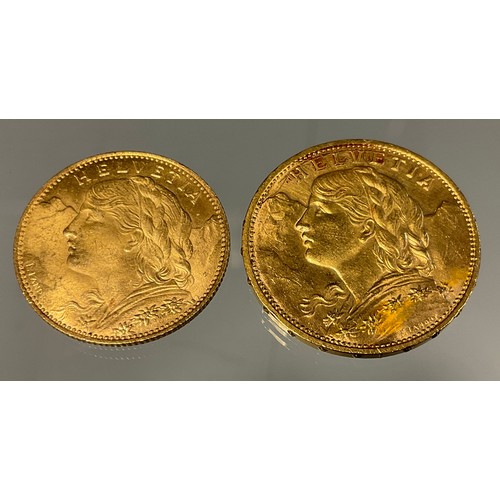 415 - A Swiss Helvetia 20 franc gold coins, dated 1914, another 10 Franc, dated 1922, 9.6g gross (2)