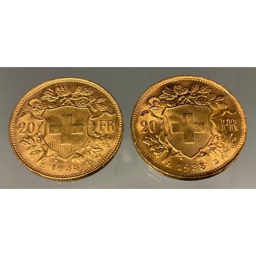 417 - A pair of Swiss Helvetia 20 franc gold coins, both part of the Restrikes issued 1945-1947, dated 193... 