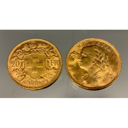 420 - A pair of Swiss Helvetia 20 franc gold coins, both part of the Restrikes issued 1945-1947, dated 193... 