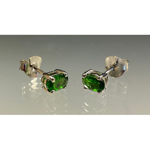 432 - A pair of Chrome diopside and silver stud earrings.