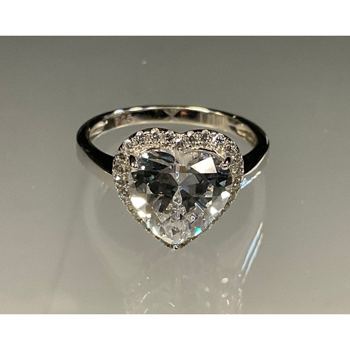 434 - A silver Love Heart dress ring,  with central heart cut white cubic zirconia surrounded by a halo of... 