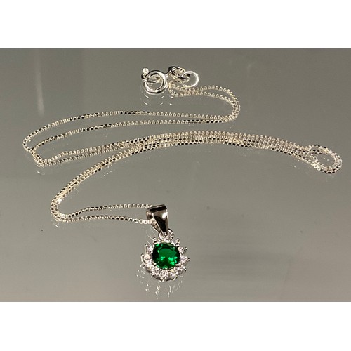 442 - A silver mounted green and white cubic zirconia pendant necklace, 925 silver chain.