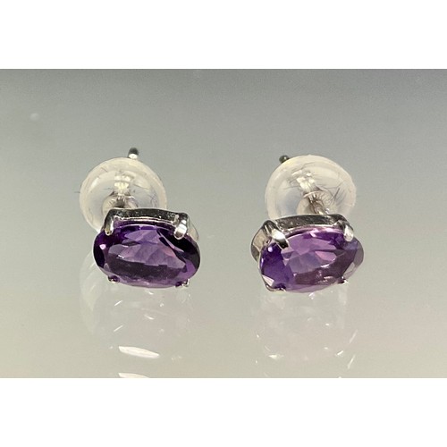 446 - A pair of oval amethyst stud earrings, total estimated amethyst weight approx 0.80ct, 18ct white gol... 