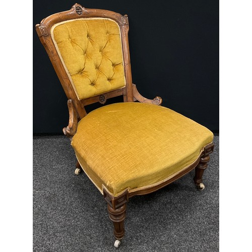 285 - A Victorian walnut salon chair, carved back with deep button upholstery, upholstered and sprung seat... 