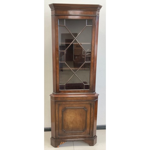 78A - A Georgian style reproduction mahogany corner cabinet, moulded cornice, Astral-glazed door to top, e... 