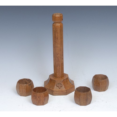 56 - Don Craven, Foxman of Yorkshire - a set of four oak octagonal napkin rings and stand, adzed overall,... 