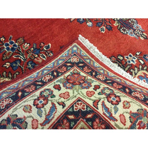 304A - A Central Persian Sarouk woollen rug / carpet, central diamond-shaped medallion, within a field of s... 