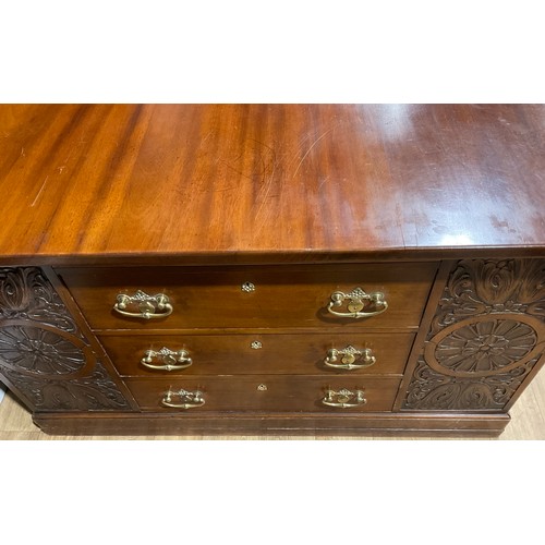 102 - A large Arts and Crafts mahogany partners’ desk, rectangular top above an arrangement of drawers, sl... 