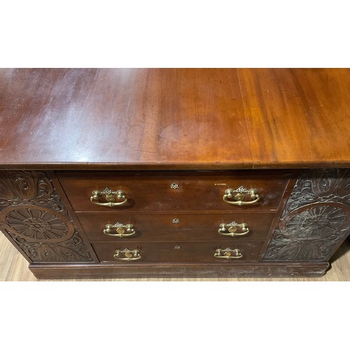 102 - A large Arts and Crafts mahogany partners’ desk, rectangular top above an arrangement of drawers, sl... 