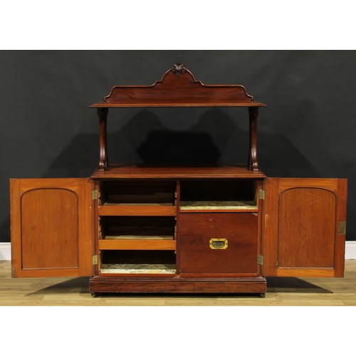 104 - A Victorian mahogany serving buffet, shaped cresting, pierced and carved end supports, the base with... 