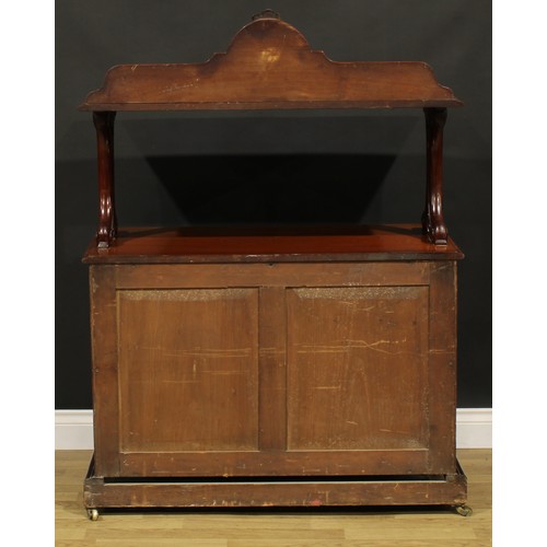 104 - A Victorian mahogany serving buffet, shaped cresting, pierced and carved end supports, the base with... 