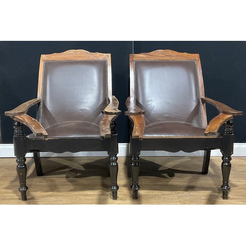 108 - A pair of Colonial hardwood plantation chairs, 73cm wide, 93cm deep (2)