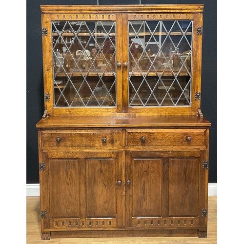 109 - An oak dresser, 179.5cm high, 129.5cm wide, 47cm deep; a similar bookcase, 152.5cm high, 122cm wide,... 