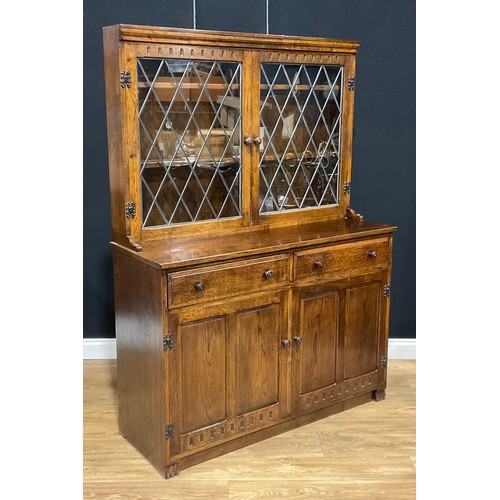 109 - An oak dresser, 179.5cm high, 129.5cm wide, 47cm deep; a similar bookcase, 152.5cm high, 122cm wide,... 