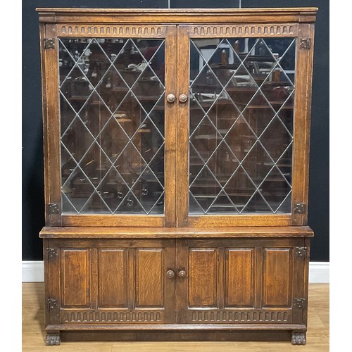 109 - An oak dresser, 179.5cm high, 129.5cm wide, 47cm deep; a similar bookcase, 152.5cm high, 122cm wide,... 