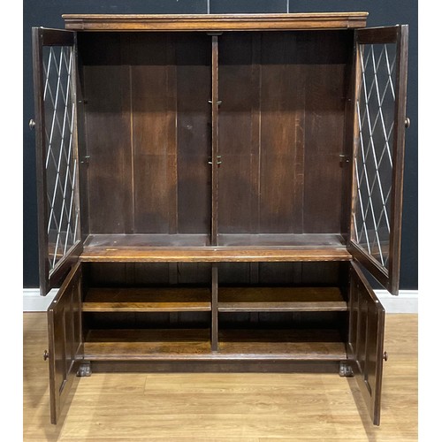 109 - An oak dresser, 179.5cm high, 129.5cm wide, 47cm deep; a similar bookcase, 152.5cm high, 122cm wide,... 