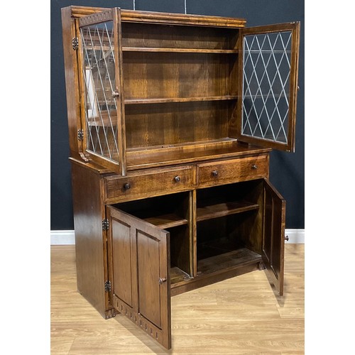 109 - An oak dresser, 179.5cm high, 129.5cm wide, 47cm deep; a similar bookcase, 152.5cm high, 122cm wide,... 