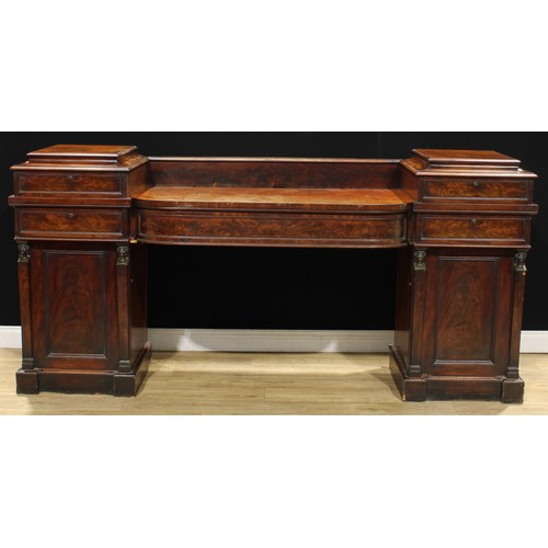 117 - A Regency bronze mounted flame mahogany bow-centre sideboard, long central frieze drawer, flanked by... 