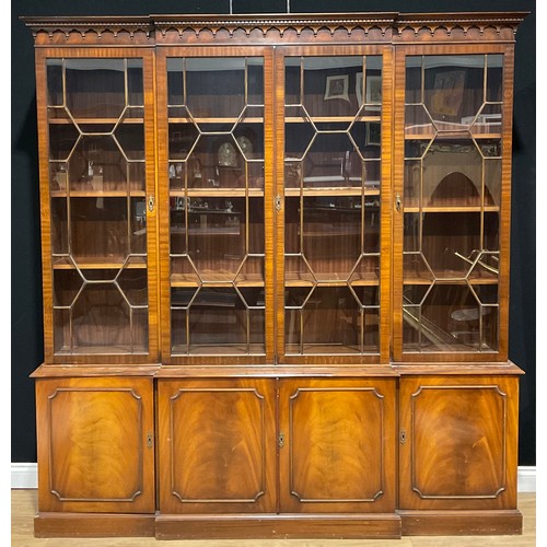 120 - A Reprodux George III style break-centre library bookcase, 214.5cm high, 204.5cm wide, 39.5cm deep