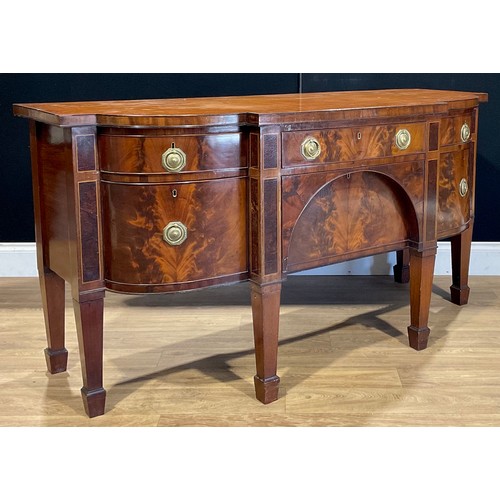 110A - A George III mahogany serving table or sideboard, slightly oversailing top above an arrangement of d... 