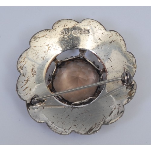 703 - A Scottish silver and gold coloured metal shaped circular plaid brooch, applied with thistles and ce... 