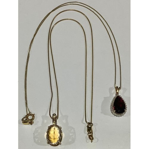 709 - A 9ct gold necklace with citrine pendant, marked 375, 5.7g; a 9ct gold necklace with 9ct gold mounte... 