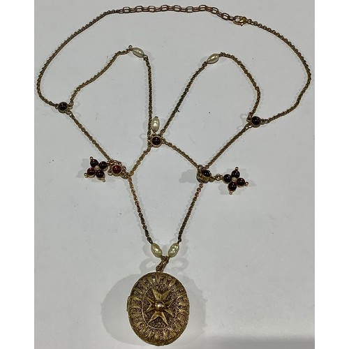 713 - An ornate filigree locket, mounted with Maltese cross, on stone set chain