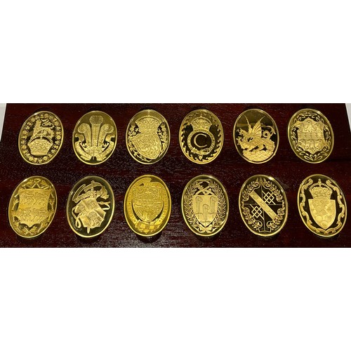 730 - A set of 12 oval silver gilt plaques or ingots for the arms of the Prince and Princess of Whales, pr... 