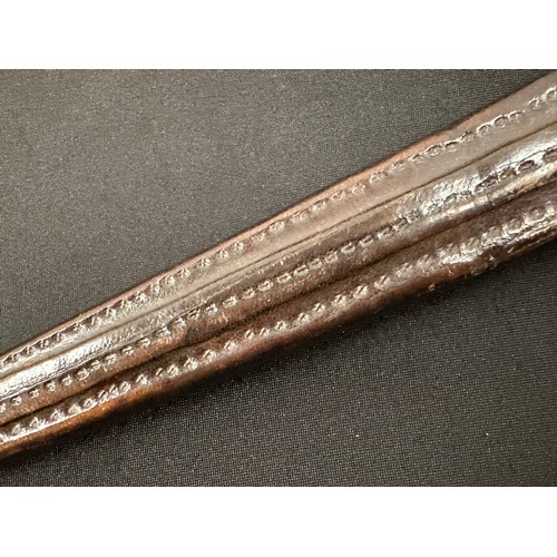 2056 - Dagger with double edged blade 260 mm in length. Blade decorated with punch mark patterns. Brass gri... 
