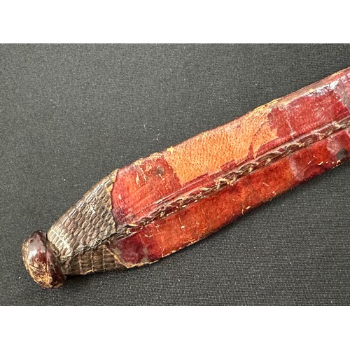2057 - African Dagger with double edged blade 87 mm in length. Geometric pattern decoration to the blade. W... 