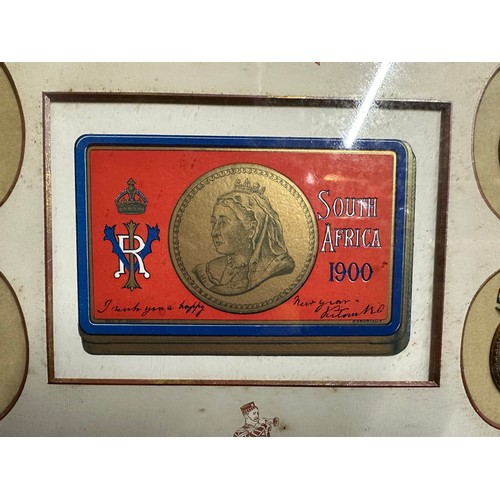 2067 - British Boer War framed display showing a printed copy of the Queen Victoria gift tin surrounded by ... 