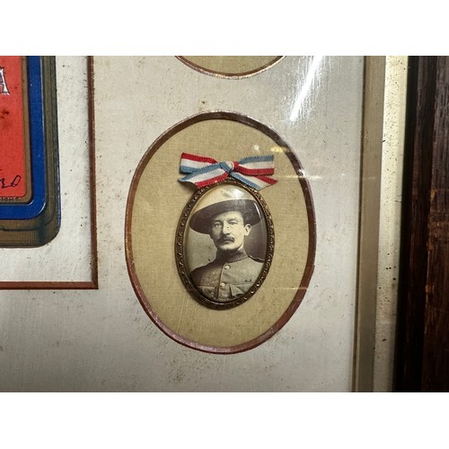 2067 - British Boer War framed display showing a printed copy of the Queen Victoria gift tin surrounded by ... 