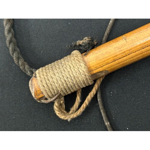 2071 - Bosuns Persuader. Carved wooden pommel. Overall length 305mm. Hanging cord along with plaited strap.