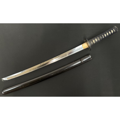 2088 - Japanese Wakizashi Sword with single edged blade 540mm in length. Hamon line to cutting edge. Some c... 