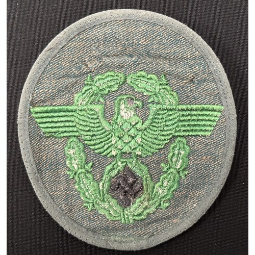 2253 - WW2 Third Reich Police Sleeve Eagle group. Two are uniform removed while the third appears unissued.... 