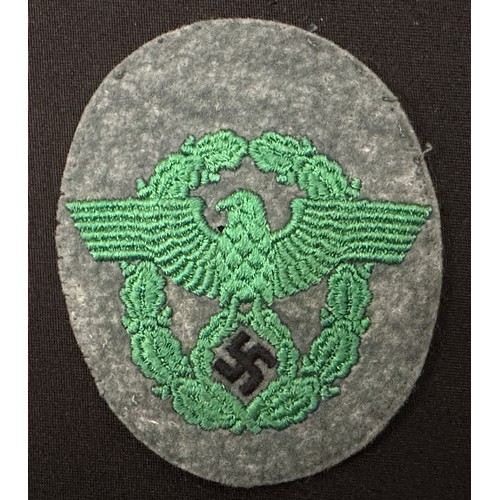 2253 - WW2 Third Reich Police Sleeve Eagle group. Two are uniform removed while the third appears unissued.... 