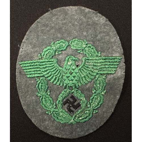 2253 - WW2 Third Reich Police Sleeve Eagle group. Two are uniform removed while the third appears unissued.... 