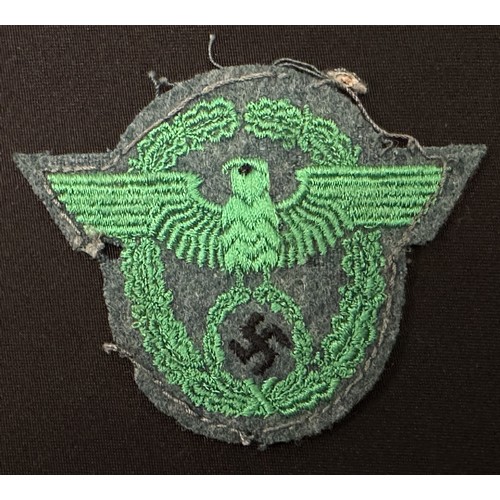 2253 - WW2 Third Reich Police Sleeve Eagle group. Two are uniform removed while the third appears unissued.... 