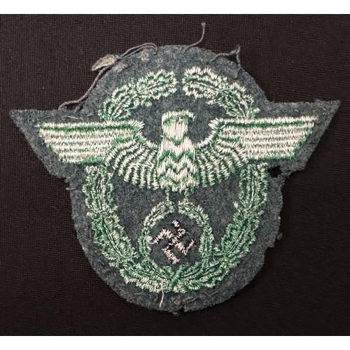 2253 - WW2 Third Reich Police Sleeve Eagle group. Two are uniform removed while the third appears unissued.... 