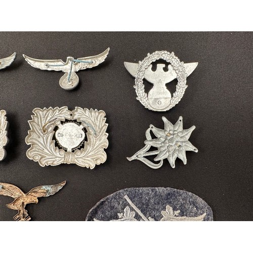 2254 - WW2 Third Reich uniform removed insignia to include: Pair of Zoll cap eagle plus wreath and cockades... 