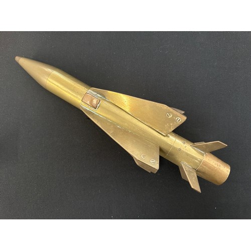 2302 - Brass Trench Art Missiles x 2, Bugles x 2, Rotor blade from Harrier Jump Jet, Glengary Hat.