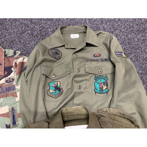 2304 - Collection of post war USAF uniforms to include: USAF Coat, Hot Weather, Woodland Camo pattern Comba... 